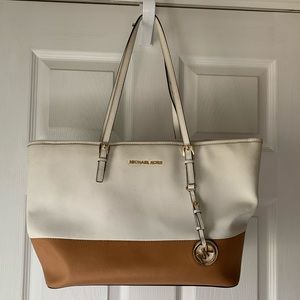 White & tan Michael Kors shoulder bag.